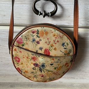 Gently used Patricia Nash 8” round Prarie Rose shoulder bag. tiny mark on back